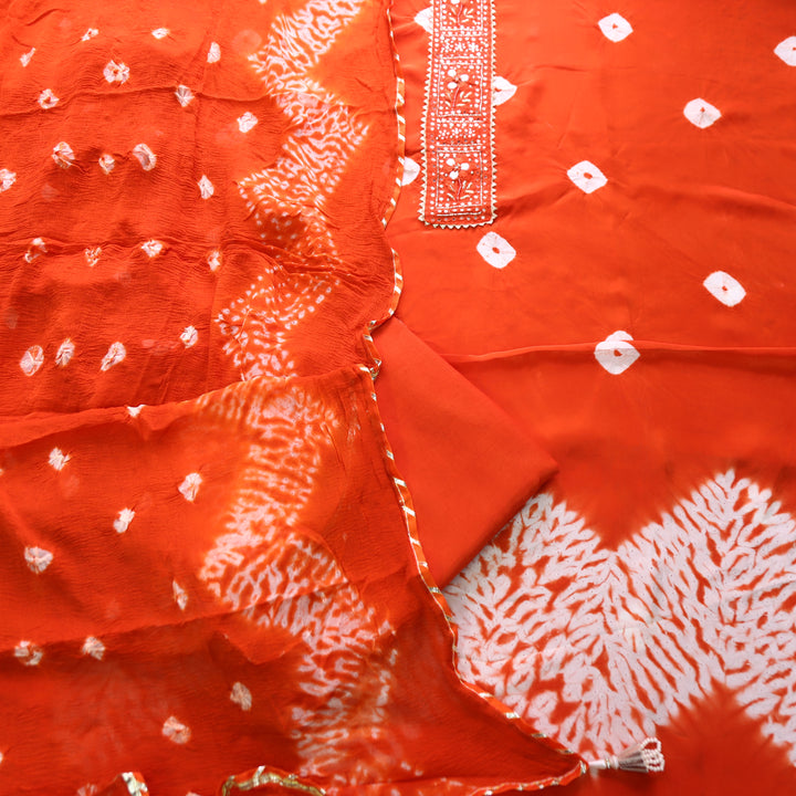 Vasudara Orange Embellished Work Bandhej and Shibori Hem Crepe Set