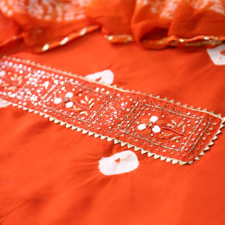 Vasudara Orange Embellished Work Bandhej and Shibori Hem Crepe Set