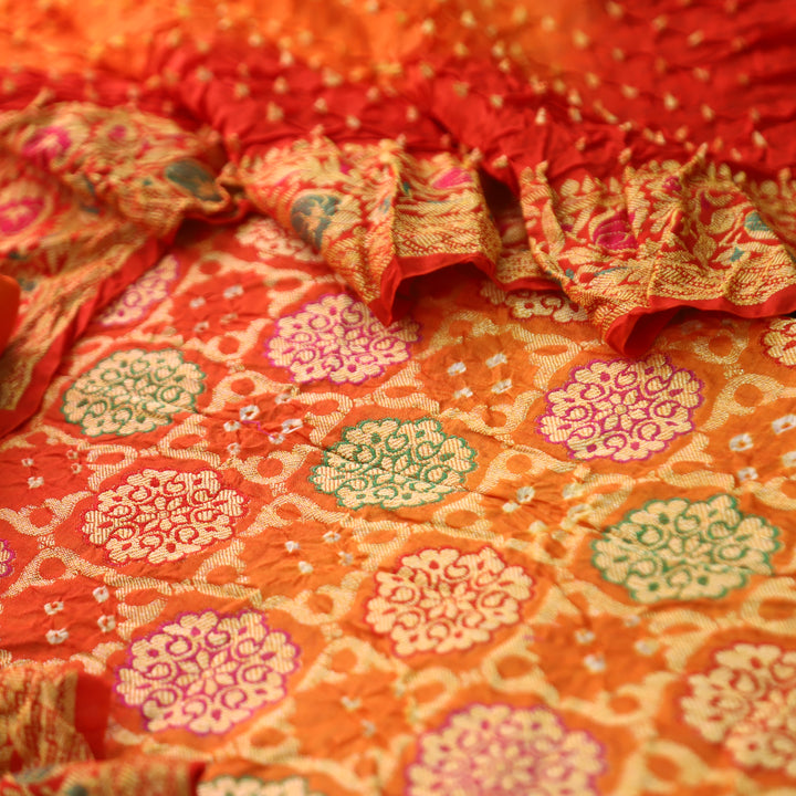 Nirvi Fire Orange All Over Bandhej Work Crepe Silk Set