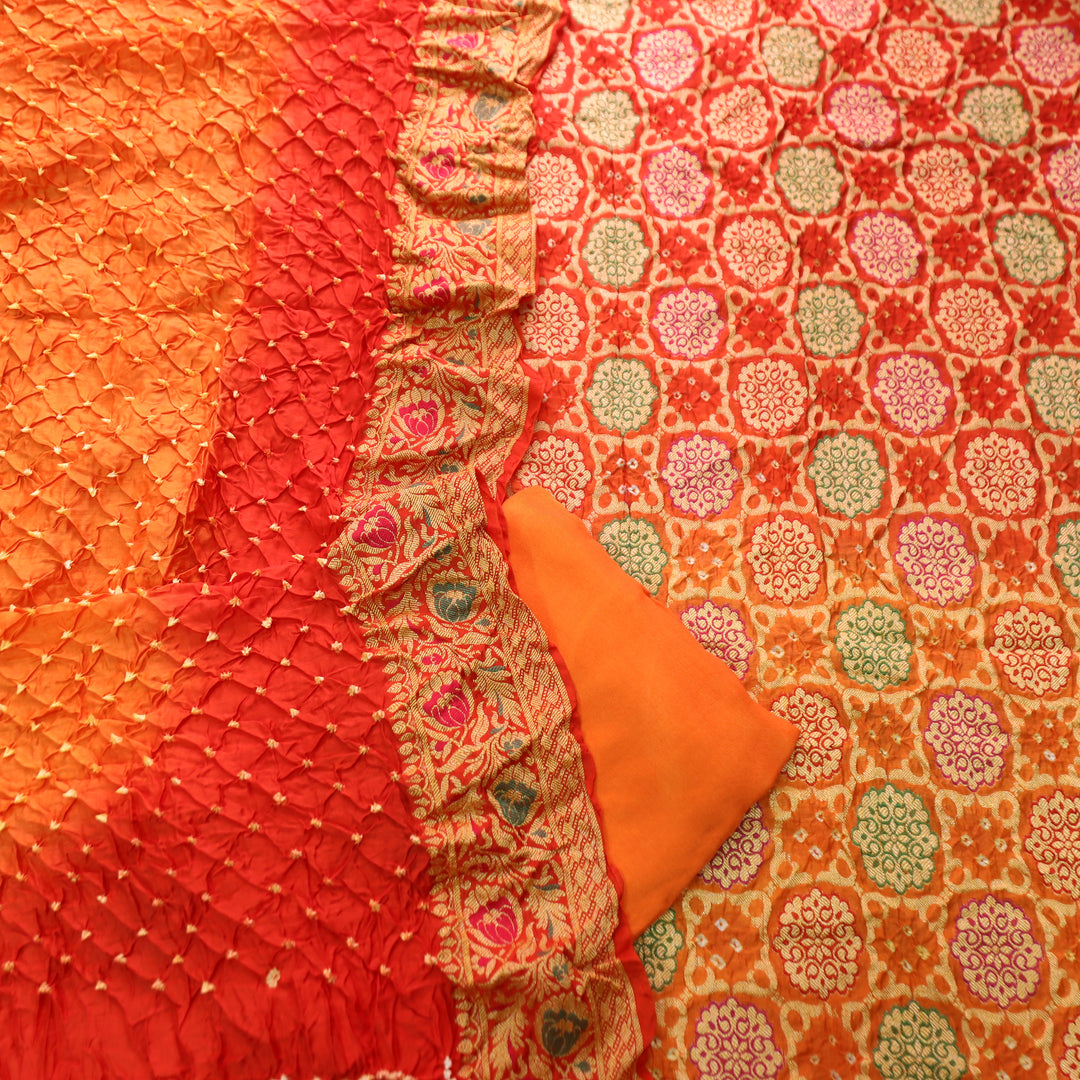 Nirvi Fire Orange All Over Bandhej Work Crepe Silk Set