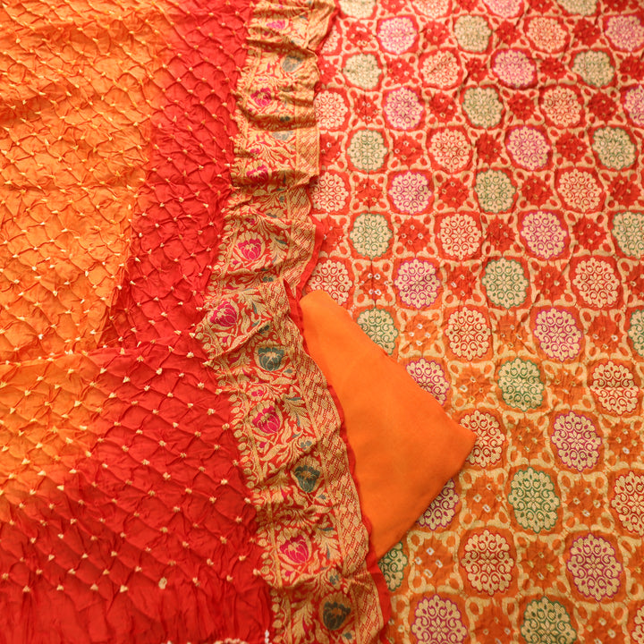 Nirvi Fire Orange All Over Bandhej Work Crepe Silk Set