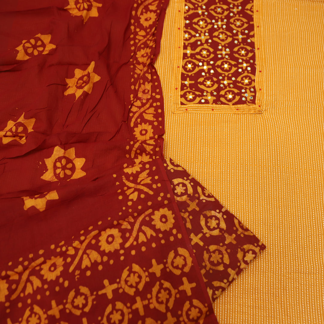 Sambhavi Tang Orange Batik Print with Patra Work Running Stitch Cotton Set