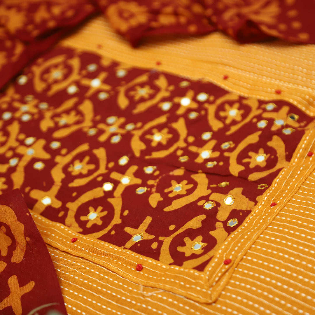 Sambhavi Tang Orange Batik Print with Patra Work Running Stitch Cotton Set