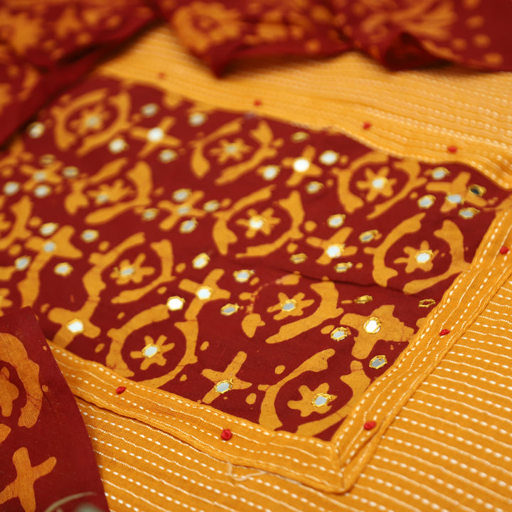 Sambhavi Tang Orange Batik Print with Patra Work Running Stitch Cotton Set