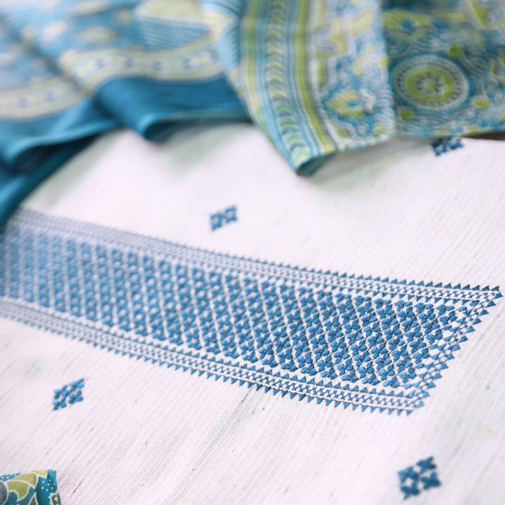 Aathiya Shell White with Blue Thread Embroidered and Buti Work Cotton Suit Set