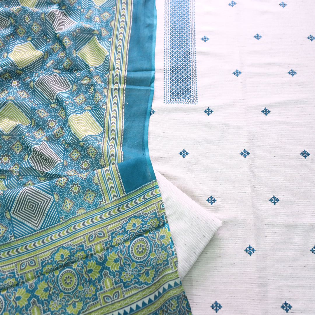 Aathiya Shell White with Blue Thread Embroidered and Buti Work Cotton Suit Set