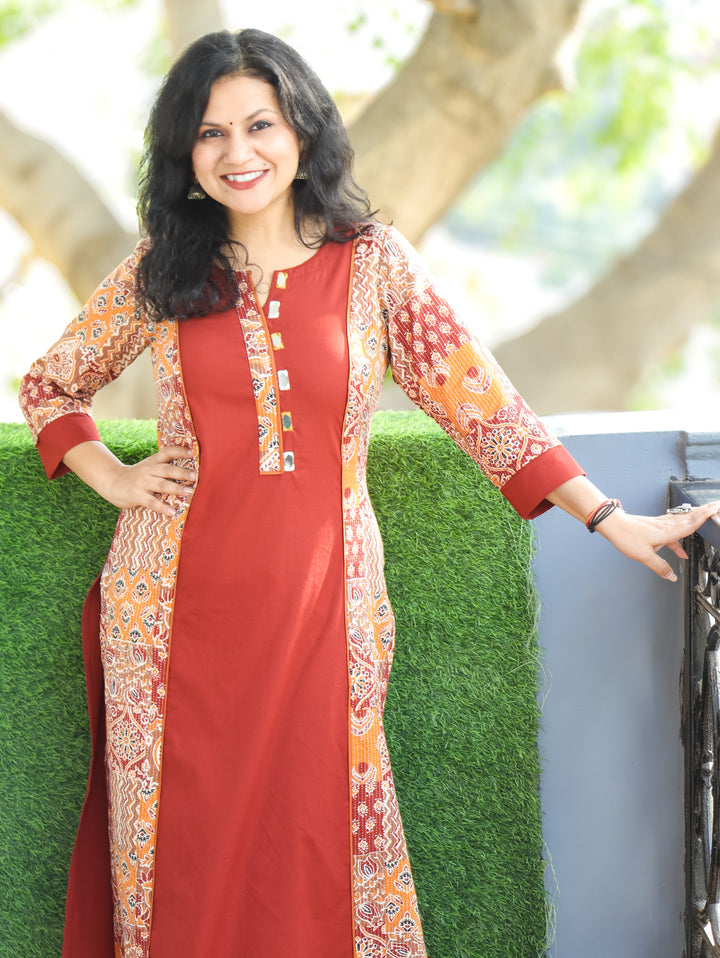 Khushi Burnt Rust Mirror Work Round Neck Running Stitch Ajrak Print Panel Cotton Kurti