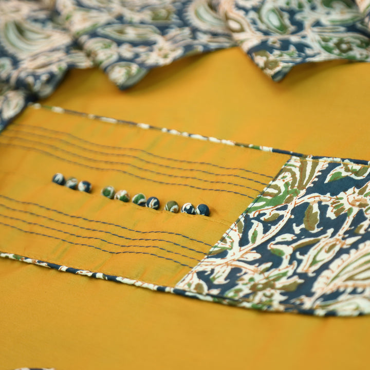 Radhika Turmeric Yellow Potli Button with Kalamakari Printed Neck Patch Cotton Suit Set