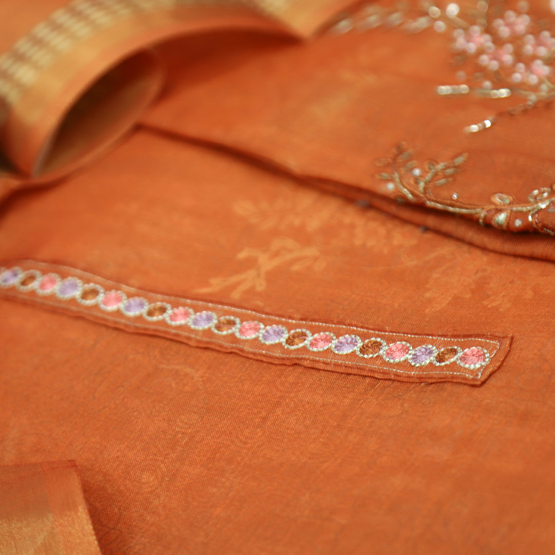 Hosaana Rust Orange Self Print Embroidered Work with Kardana Shimmer Tissue Linen Set