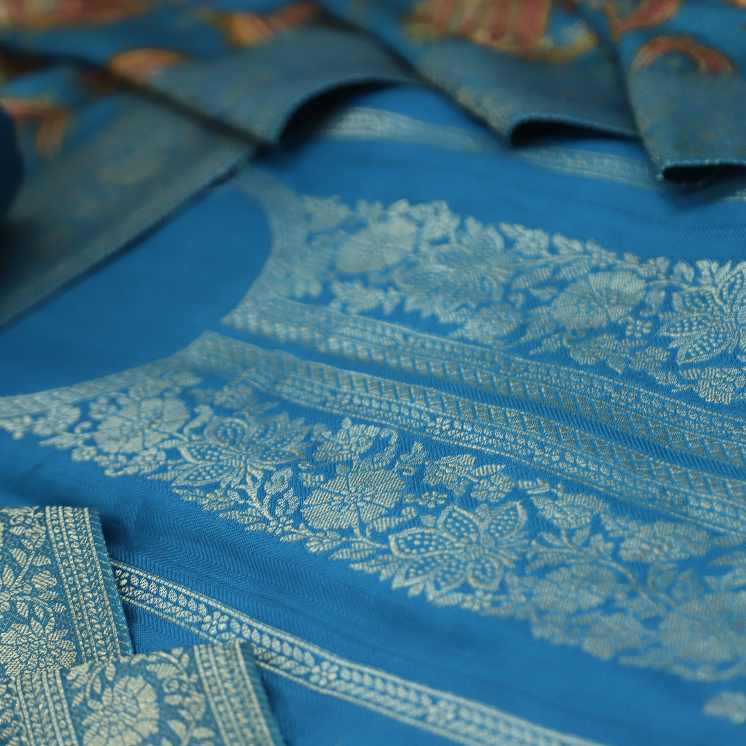 रुक्मणी Aashmani Blue Zari Weaved in Panel Style Work Semi Pashmina Winter Suit Set