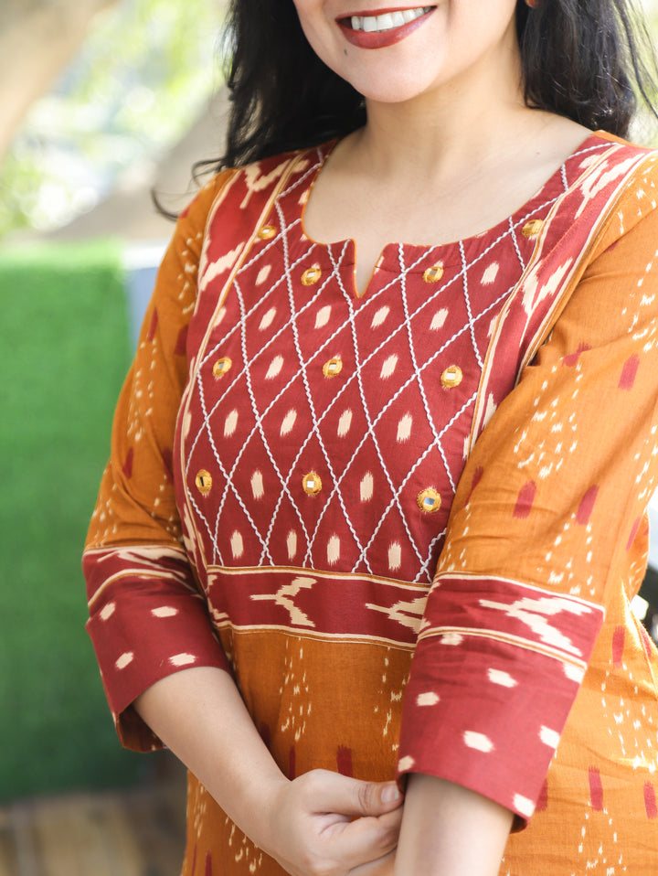 Kesariya Peanut Yellow with Barn Rust Yoke with Mirror Work Ikkat Printed Cotton Kurti