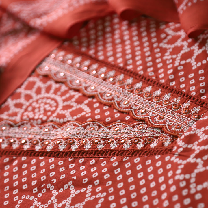 Riwaish Rust Orange Cut Work Thread Lace V Neck Bandhani Print Cotton Suit Set