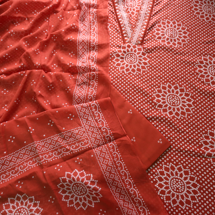 Riwaish Rust Orange Cut Work Thread Lace V Neck Bandhani Print Cotton Suit Set