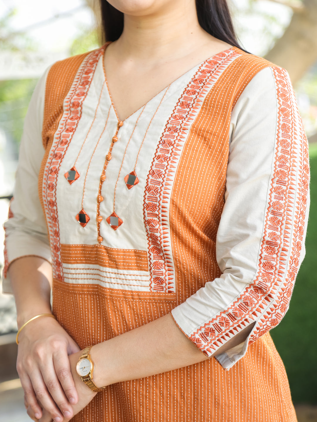 Saundraya Tangerine Rust Mirror with Potli Button Work Yoke Running Stitch Cotton Kurti