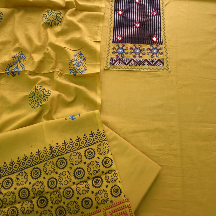 Kusumdari Turmeric Yellow Ajrak Printed Yoke with Mirror Work Cotton Suit Set
