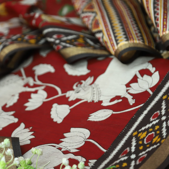 Saatvi Cherry Red Pichwai Print with Ikkat Print Hem Viscose Maheshwari Set