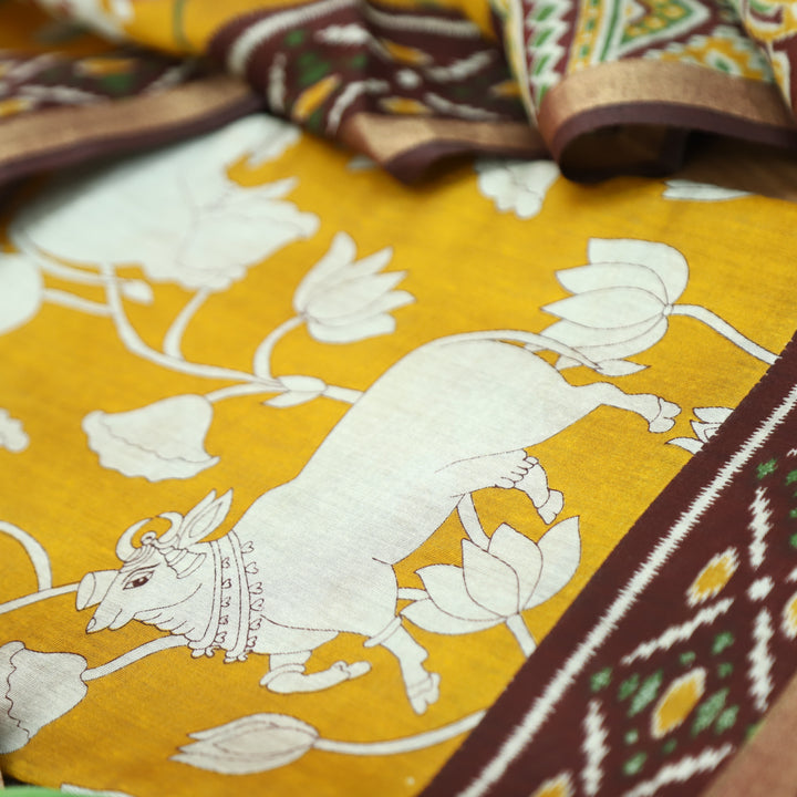 Saatvi Corn Yellow Pichwai Print with Ikkat Print Hem Viscose Maheshwari Set