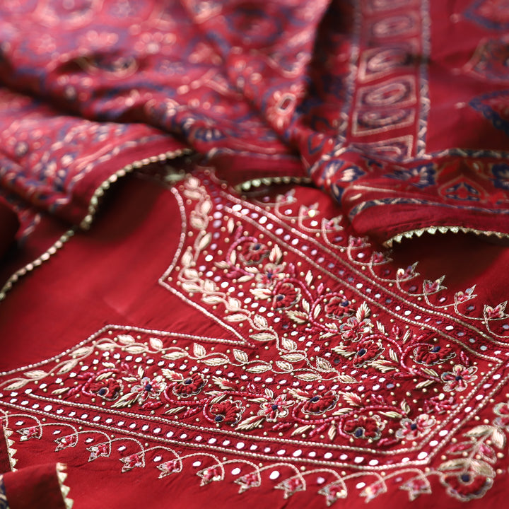 Shreya Maroon Red Embellish Neck Work with Patra Detailing Dola Silk Set