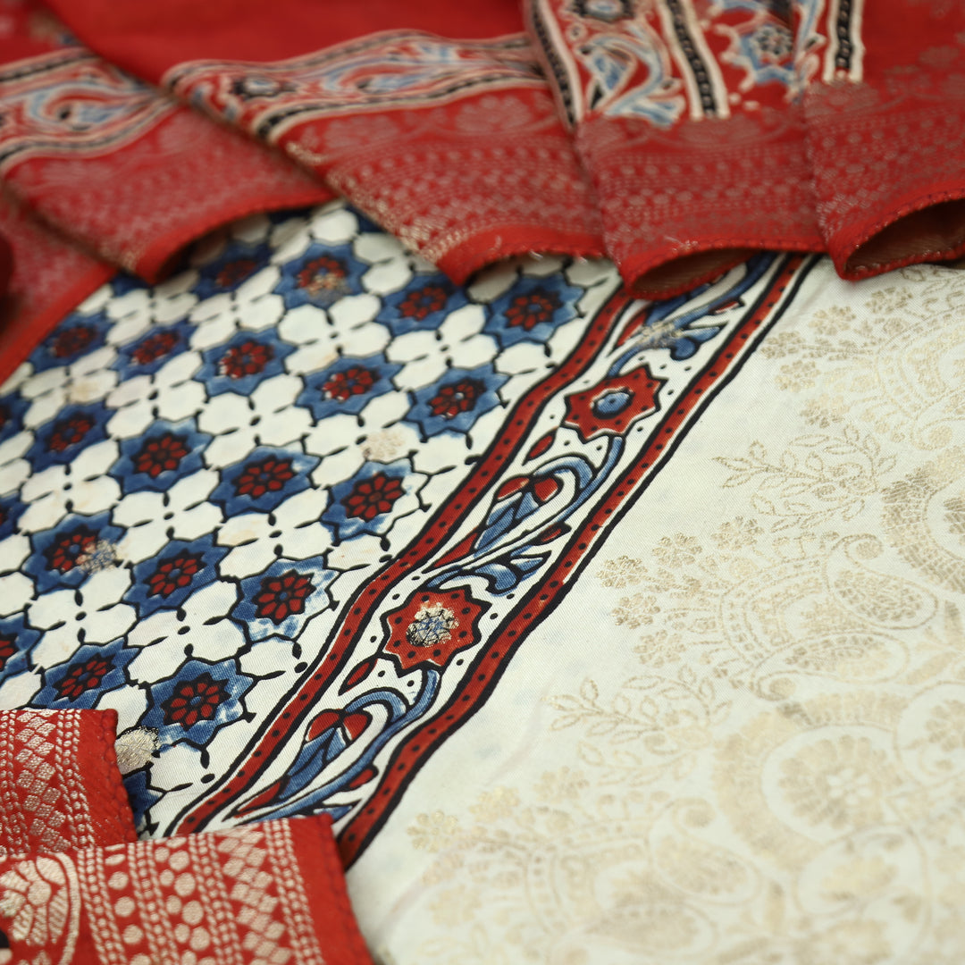 Musafir Pearl White Zari Woven Hem Ajrak Printed Dola Silk Set
