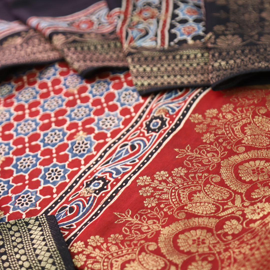 Musafir Marron Red Zari Woven Hem Ajrak Printed Dola Silk Set