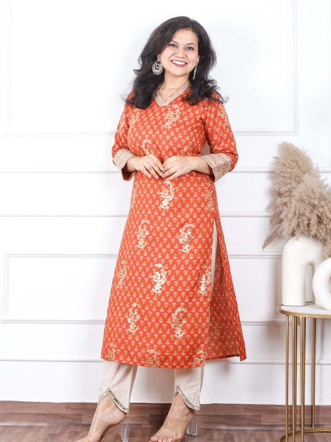 Sajna Amber Orange V Neck In Floral Printed with Foil Work Muslin Kurti