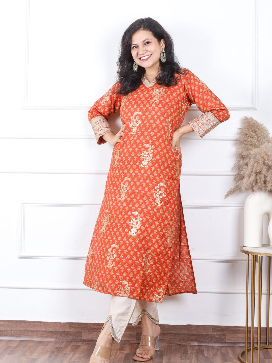 Sajna Amber Orange V Neck In Floral Printed with Foil Work Muslin Kurti