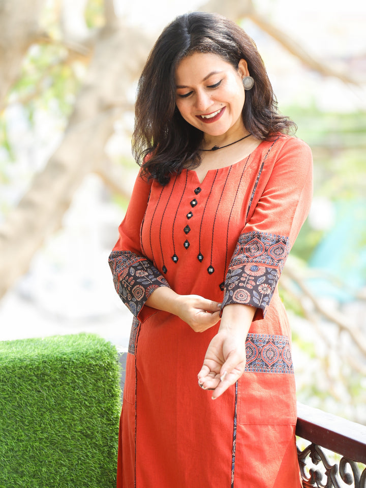 Aafeemi Burnt Orange Mirror Neck Work with Pocket Cotton Kurti