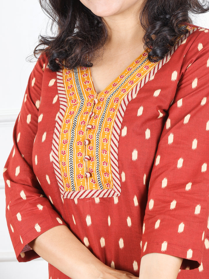 Hariyali Dark Barn Rust V Neck Patch with Polti Button Work in Ikkat Printed Cotton Kurti