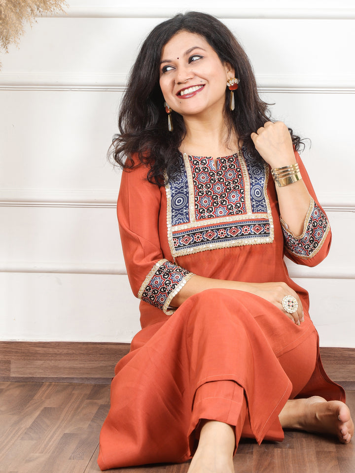 Nirvi Barn Rust Mashru Patch Work Neck with Golden Lace Roman Silk Kurti