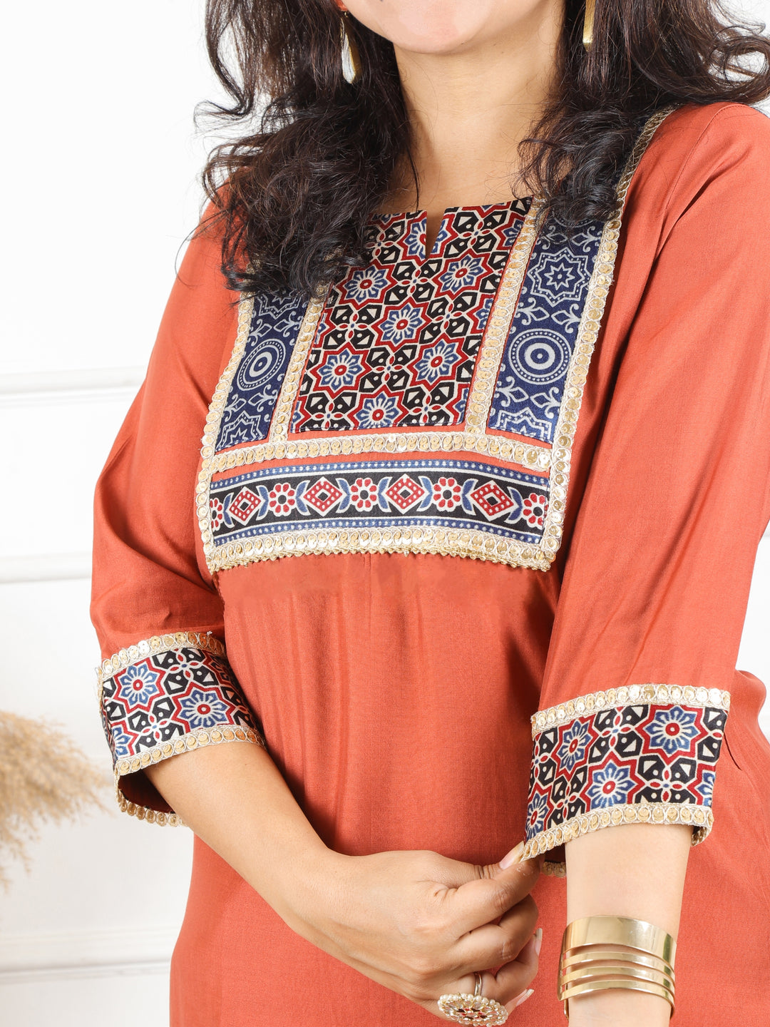 Nirvi Barn Rust Mashru Patch Work Neck with Golden Lace Roman Silk Kurti