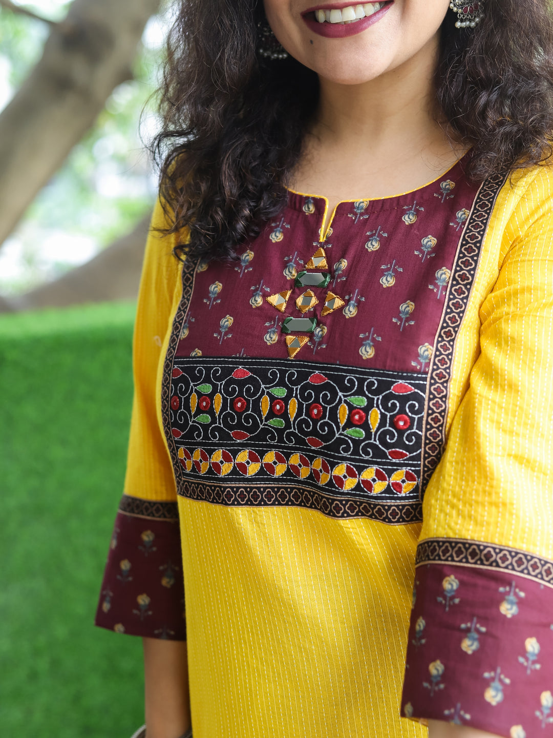 Mehek Bright Yellow with Floral printed Yoke and Mirror Work Running Stitch Cotton Kurti