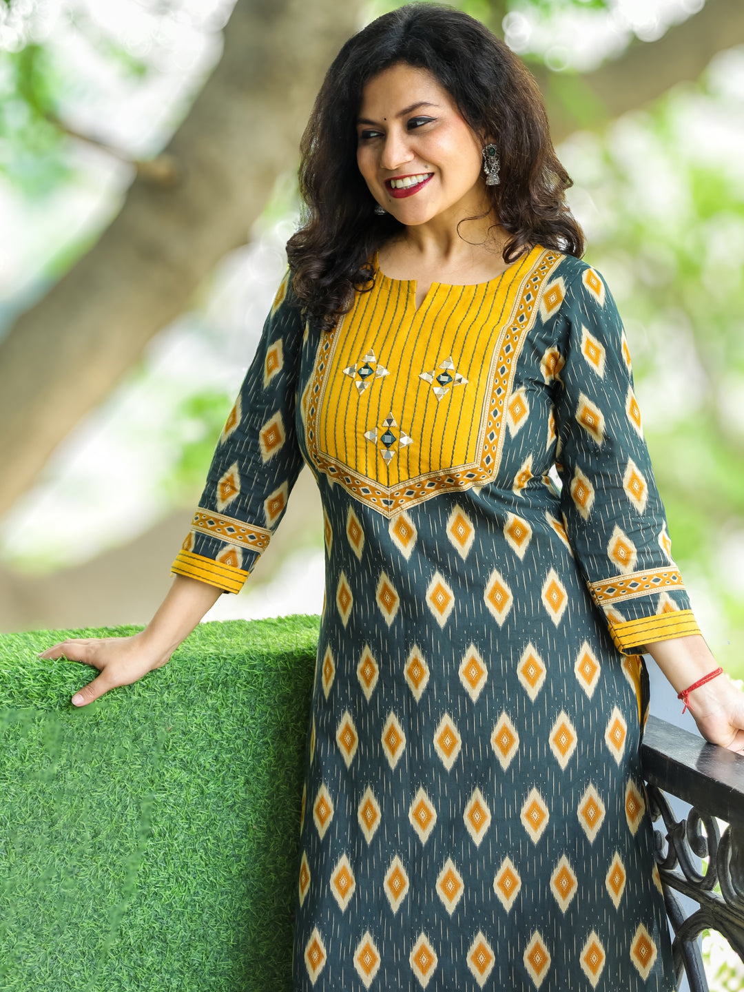 Ragini Pine Green Thread Work Yoke with Mirror Detailing in Ikkat Printed Cotton Kurti