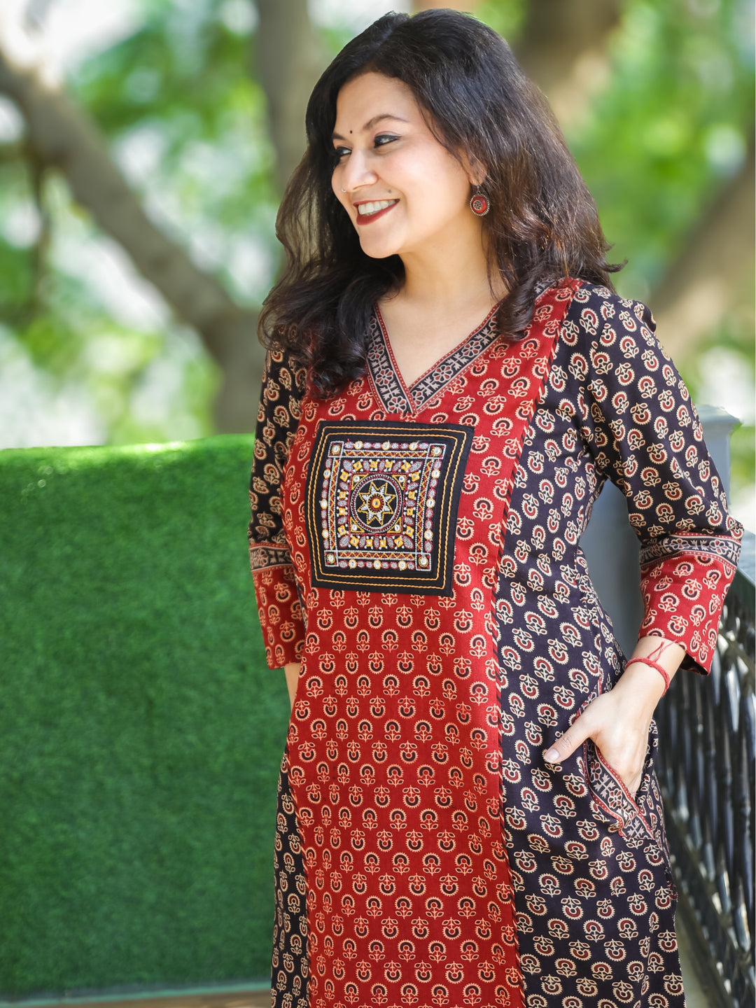 Keshvi Ebony Black V Neck Embroidered Patch in Panel Style Ajrak Printed Cotton Kurti