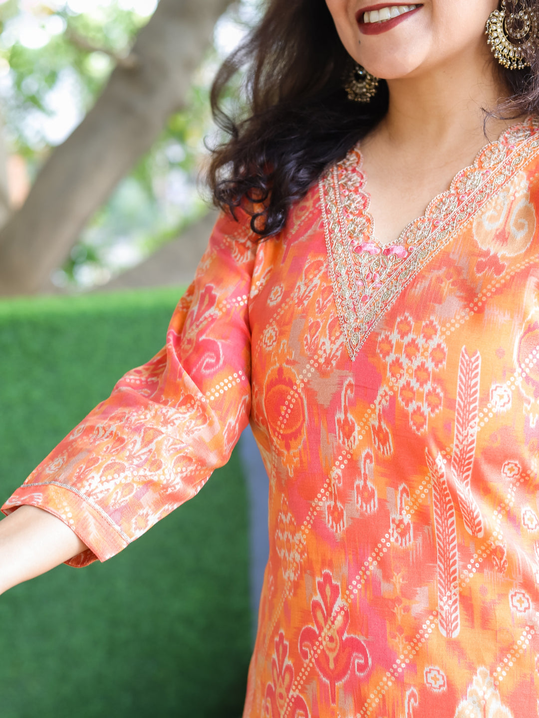 Daarshvi Pumpkin Orange V Embellish Neck Work in Digital Floral Print Modal Kurti