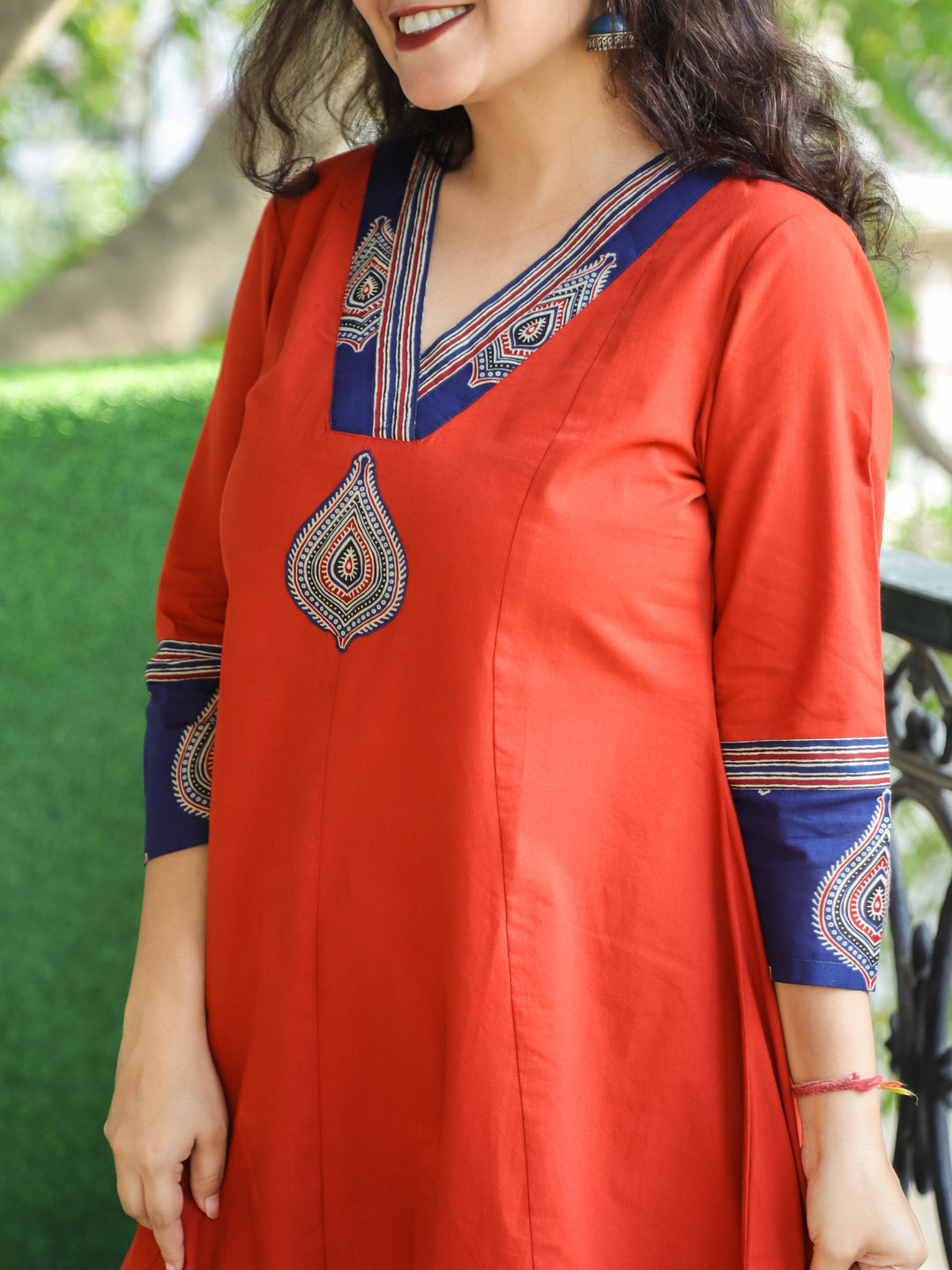 Rivaazi Rust Orange V Neck and Mirror Patch in Printed Hemline Anarkali Cotton Kurti