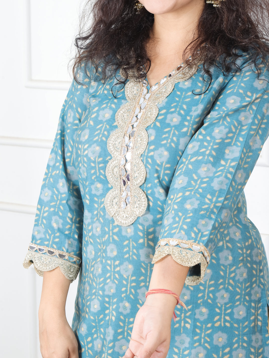 Sohni Turq Teal V Neck with Embellish Mirror Lace and Foil Work Printed Modal Kurti