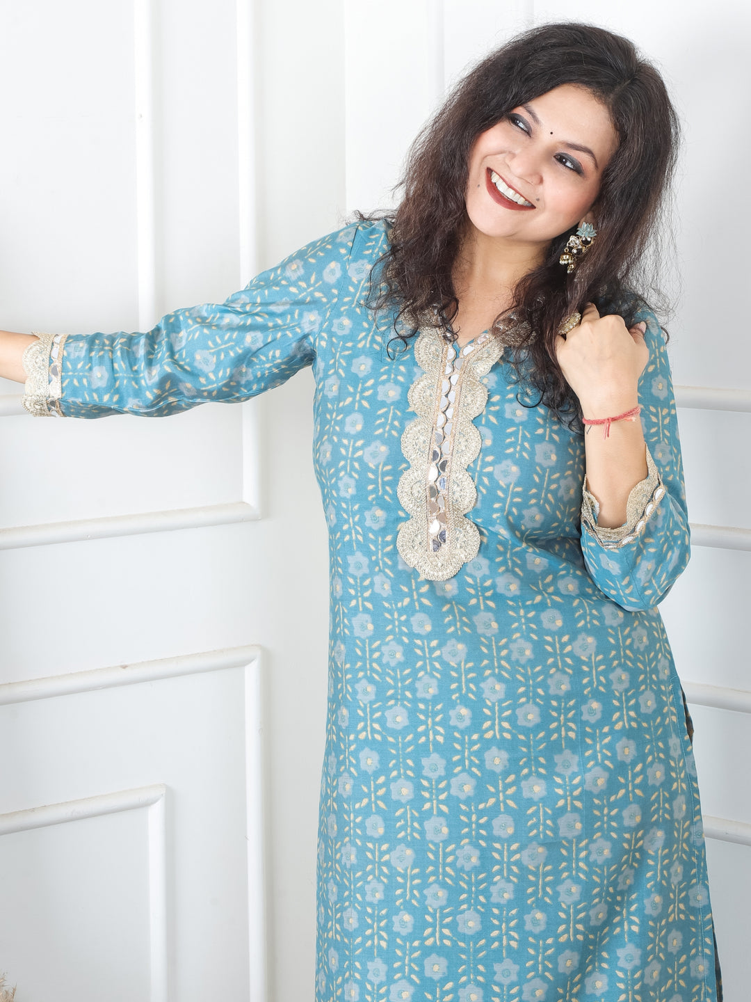 Sohni Turq Teal V Neck with Embellish Mirror Lace and Foil Work Printed Modal Kurti