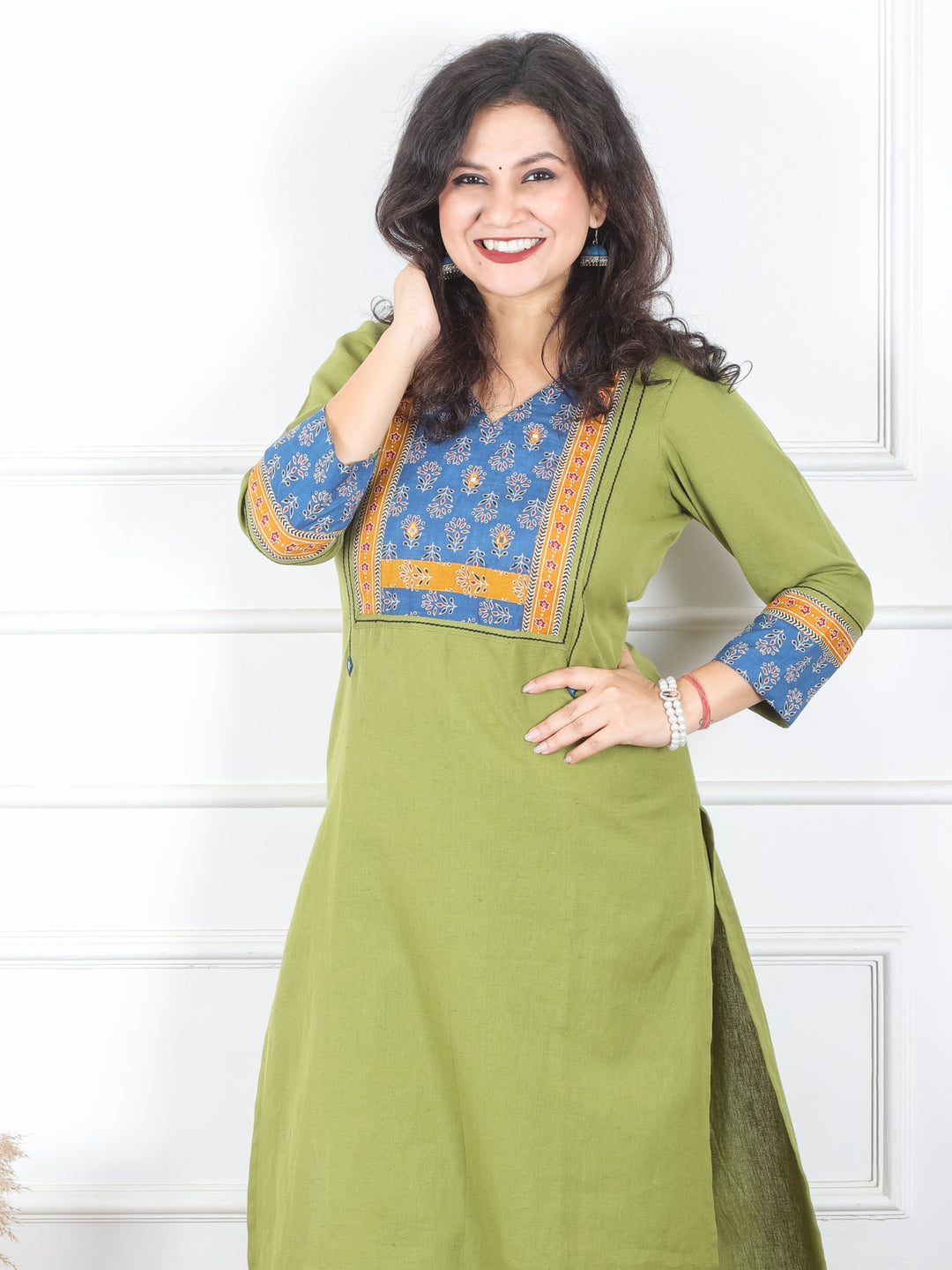 Payal Pine Green V Neck with Floral Printed Yoke in Plain Cotton Kurti