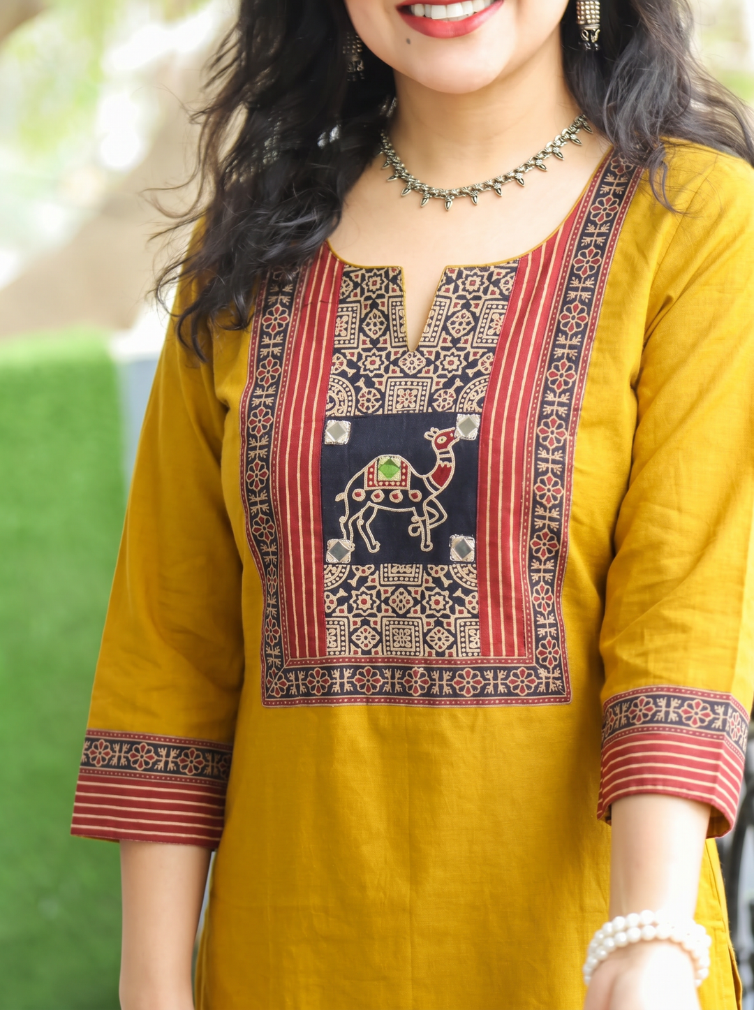 Megha Yellow Mirror Work Camel Yoke Cotton Kurti