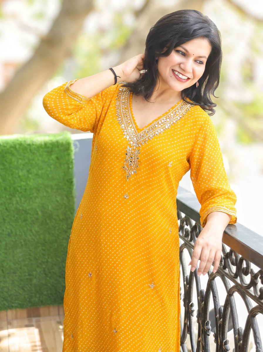 Rimmi Yellow Embellished Neck Leheriya Georgette Kurti